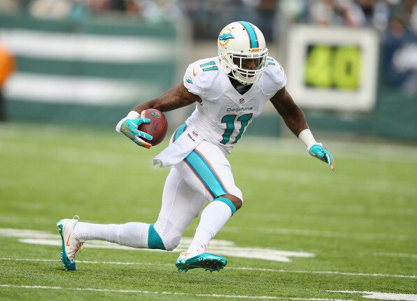 EAST RUTHERFORD, NJ - DECEMBER 01: Mike Wallace #11 of the Miami Dolphins in action against the New York Jets during their game at MetLife Stadium on December 1, 2013 in East Rutherford, New Jersey. (Photo by Al Bello/Getty Images)