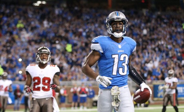 DETROIT, MI - NOVEMBER 24: Nate Burleson #13 of the Detroit Lions celebrates after scoring on a five yard pass during the second quarter of the game against the Tampa Bay Buccaneers during the game at Ford Field on November 24, 2013 in Detroit, Michigan. Tampa Bay defeated the Lions 24-21. (Photo by Leon Halip/Getty Images)