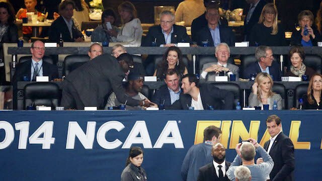 Jason Garrett, Tony Romo, jason Witten and DeMarco Murray attend the NCAA Men's Basketball National Championship Game