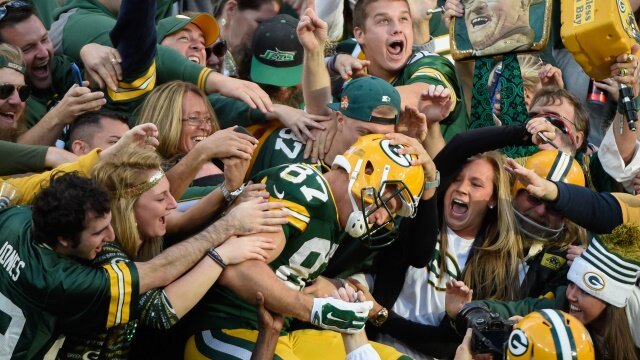 Sep 14, 2014; Green Bay, WI, USA; Green Bay Packers wide receiver Jordy Nelson (87) celebrates with fans after catching an 80-yard touchdown pass in the third quarter against the New York Jets at Lambeau Field. Mandatory Credit: Benny Sieu-USA TODAY Sports