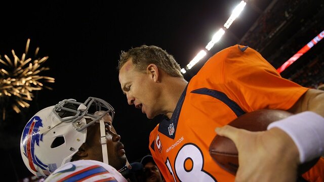 DENVER, CO - DECEMBER 7: Quarterback Peyton Manning #18 of the Denver Broncos is congratulated by running back Fred Jackson #22 of the Buffalo Bills after the Broncos defeated the Bills 24-17 at Sports Authority Field Field at Mile High on December 7, 2014 in Denver, Colorado. (Photo by Justin Edmonds/Getty Images)