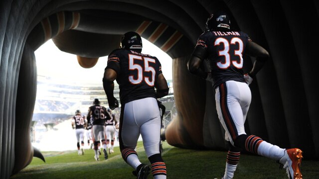 Chicago Bears-Lance Briggs and Charles Tillman running out of tunnel