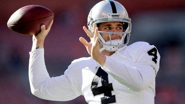 Oakland Raiders quarterback Derek Carr warms up before the game between the Cleveland Browns.