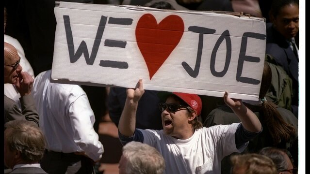San Francisco 49ers fans cheer and wave signs during quarterback Joe Montana''s retirement ceremony. 