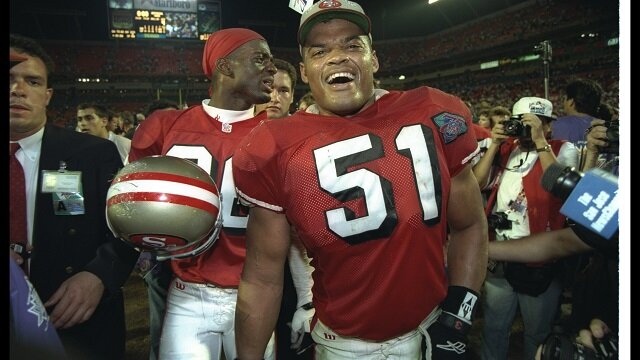 Linebacker Ken Norton #51 and defensive back Merton Hanks of the San Francisco 49ers celebrate after Super Bowl XXIX against the San Diego Chargers at Joe Robbie Stadium in Miami, Florida. 