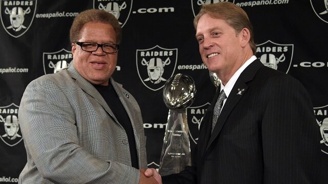 Jack Del Rio (right) poses with Oakland Raiders general manager Reggie McKenzie at press conference to announce his hiring as Raiders head coach at the Raiders practice facility