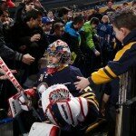 BUFFALO, NY - MARCH 09: Michal Neuvirth #34 of the Buffalo Sabres is greeted by fans before the Sabres game against the Chicago Blackhawks at First Niagara Center on March 9, 2014 in Buffalo, New York. (Photo by Sean Rudyk/Getty Images)
