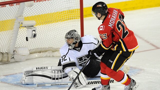 Sean Monahan of the Calgary Flames scores shootout goal against Jonathan Quick of the Los Angeles Kings