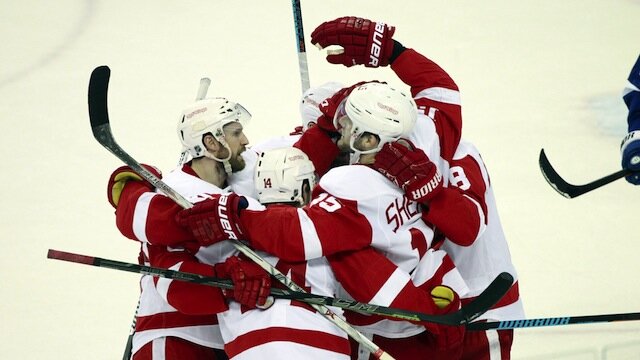 Niklas Kronwall celebrates with teammates after a goal during a 2015 game