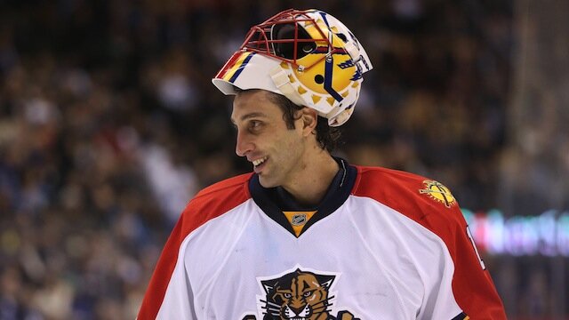 Roberto Luongo smiles during a break in the action