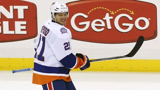 Kyle Okposo smiles during a break in the action 