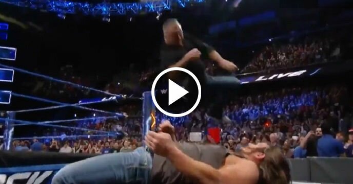 Shane McMahon Lands Insane Flying Elbow on AJ Styles Through Announce Table From Top Rope