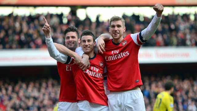 Arsenal players celebrate a goal at Emirates