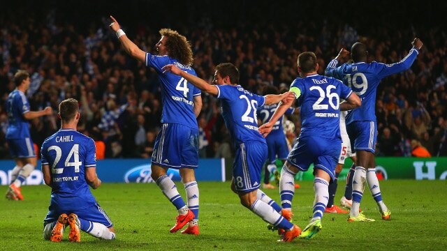 Chelsea players celebrate win over PSG in UEFA Champions League