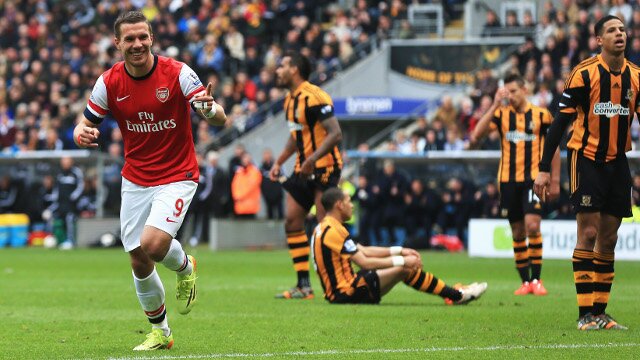 Lukas Podolski celebrates scoring for Arsenal against Hull City