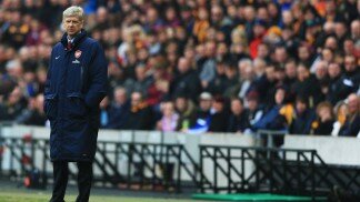Arsenal manager Arsene Wenger stands on the touchline