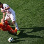 Arjen Robben is tackled by Gary Medel of Chile
