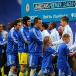 Manchester City and Chelsea players shake hands before a Premier League match