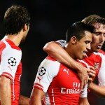 Alexis Sanchez celebrates Arsenal's win over Besiktas with teammates