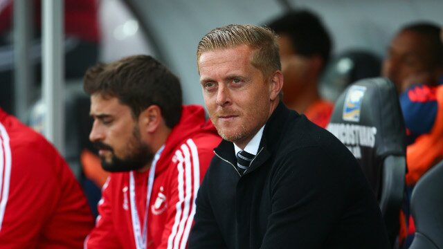Garry Monk sits on the Swansea City bench