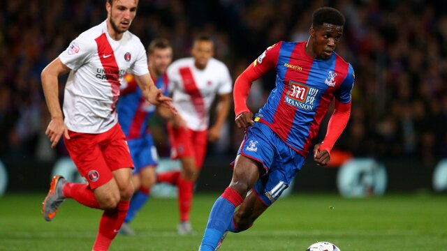 Crystal Palace winger Wilfried Zaha dribbling with the ball