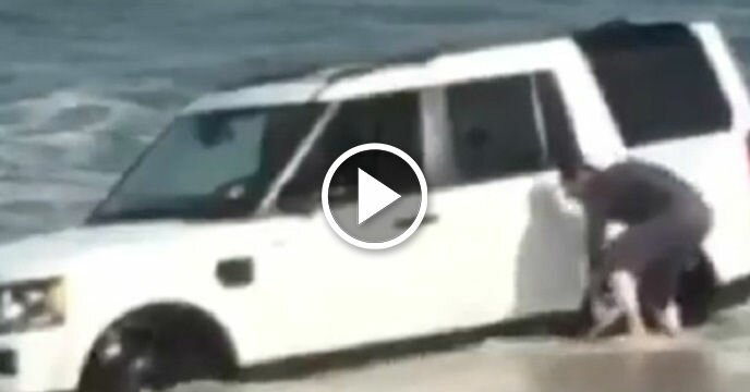 Bro Somehow Got His Vehicle Stuck in the Ocean and Attempted to Dig It Out With a Shovel