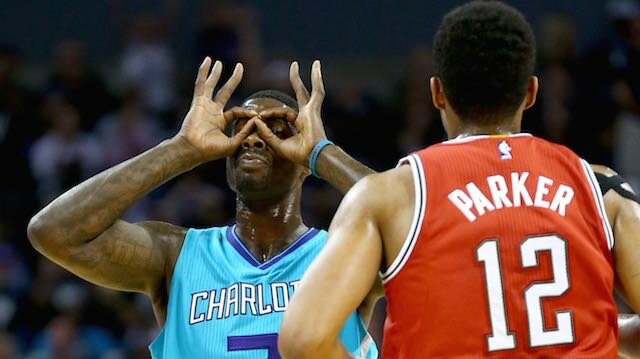 Marvin Williams #2 of the Charlotte Hornets reacts after making a basket as Jabari Parker #12 of the Milwaukee Bucks runs back up the court during their game at Time Warner Cable Arena on October 29, 2014 in Charlotte, North Carolina. (Photo by Streeter Lecka/Getty Images)