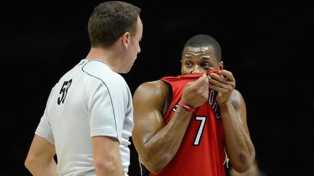 Kyle Lowry of the Toronto Raptors talks to referee Josh Tiven during the first half at Staples Center on December 27, 2014 in Los Angeles, California. (Photo by Harry How/Getty Images)