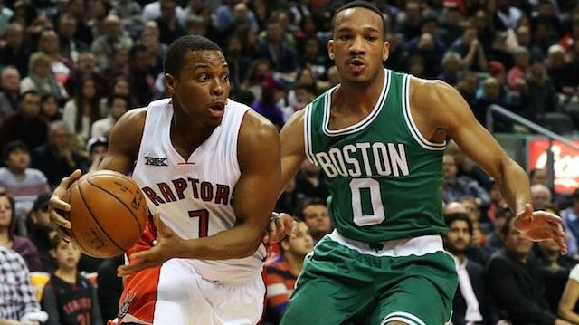 Kyle Lowry (left) of the Toronto Raptors drives to the basket past Avery Bradley of the Boston Celtics on January 10, 2015 at the Air Canada Centre in Toronto, Ontario, Canada. (Photo by Dave Sandford/NBAE via Getty Images)