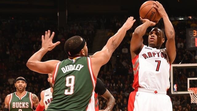 Kyle Lowry #7 of the Toronto Raptors shoots against Jared Dudley #9 of the Milwaukee Bucks on February 2, 2015 at the Air Canada Centre in Toronto, Ontario, Canada. (Photo by Ron Turenne/NBAE via Getty Images)