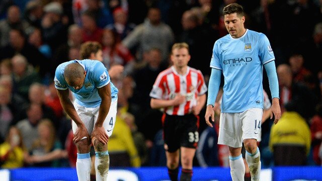 Manchester City players look dejected after a Sunderland goal